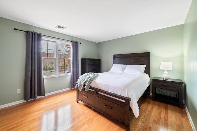 bedroom with light hardwood / wood-style floors