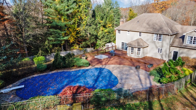 view of pool featuring a patio and a deck