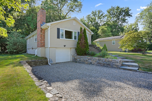 view of front of house with a garage and a front yard