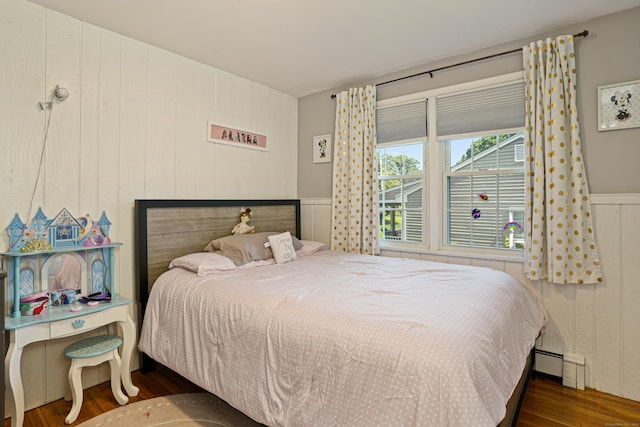 bedroom with wood finished floors