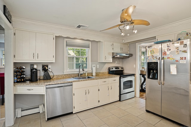 kitchen with a baseboard radiator, under cabinet range hood, a sink, visible vents, and appliances with stainless steel finishes