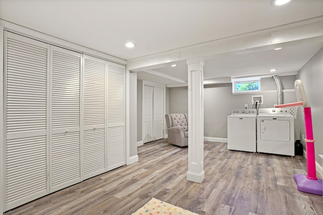 clothes washing area featuring light wood finished floors, recessed lighting, laundry area, independent washer and dryer, and baseboards