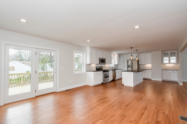 unfurnished living room featuring light wood-type flooring