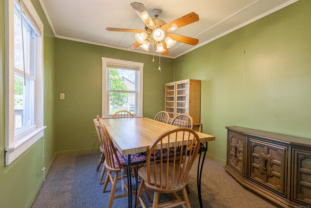 dining area featuring carpet flooring, crown molding, and ceiling fan