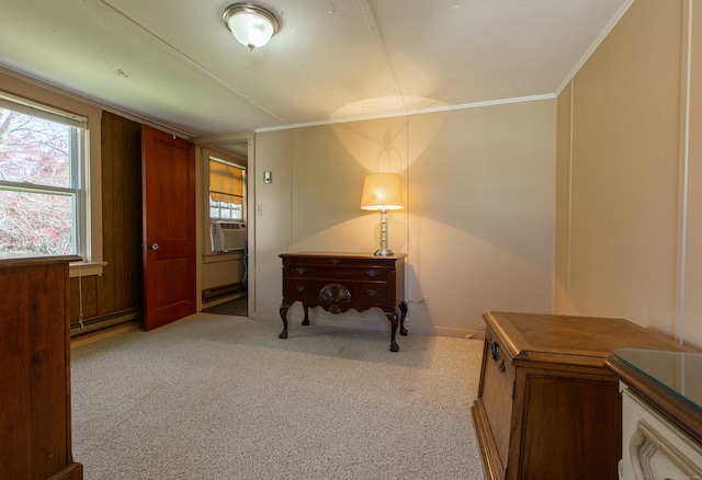 interior space with cooling unit, light carpet, baseboard heating, and crown molding