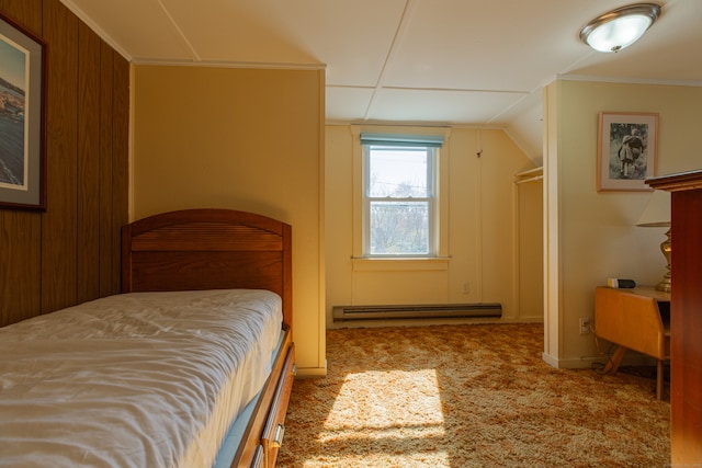 carpeted bedroom featuring lofted ceiling and a baseboard heating unit