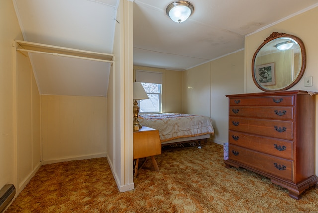 bedroom featuring carpet flooring, baseboard heating, and lofted ceiling