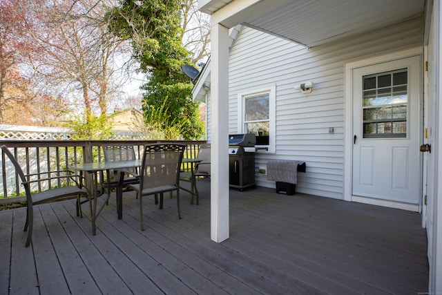 wooden deck featuring grilling area