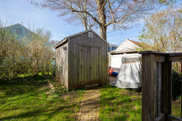 view of outdoor structure with a lawn