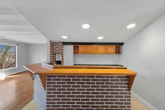 bar with light hardwood / wood-style floors