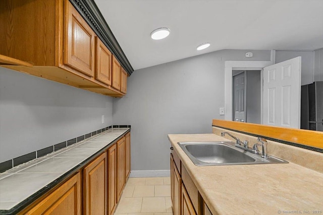 kitchen featuring sink and light tile patterned floors