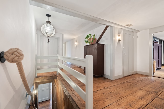 stairs featuring hardwood / wood-style flooring