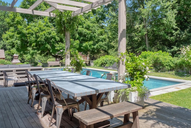 155 Joshuatown Rd, Lyme, CT 06371 - wooden deck featuring outdoor dining area, an outdoor pool, a pergola, and view of scattered trees