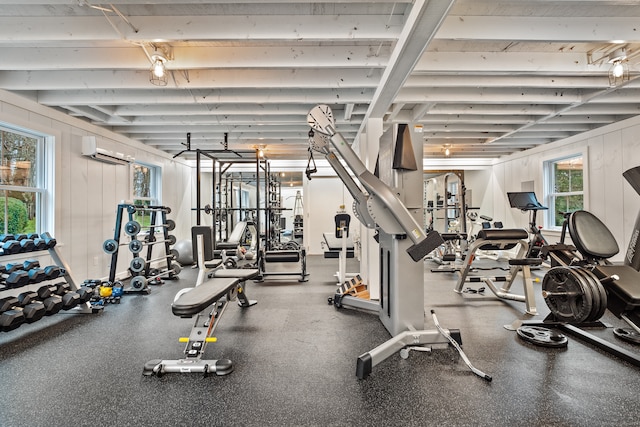 workout area featuring an AC wall unit