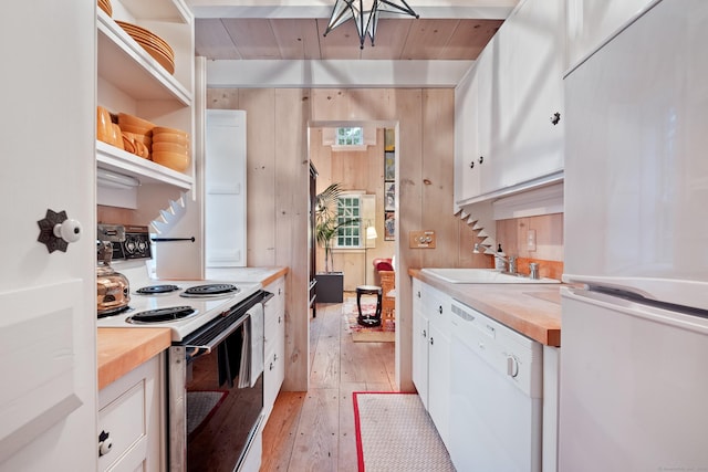 155 Joshuatown Rd, Lyme, CT 06371 - kitchen with white appliances, wood counters, white cabinets, light wood-style floors, and wooden walls