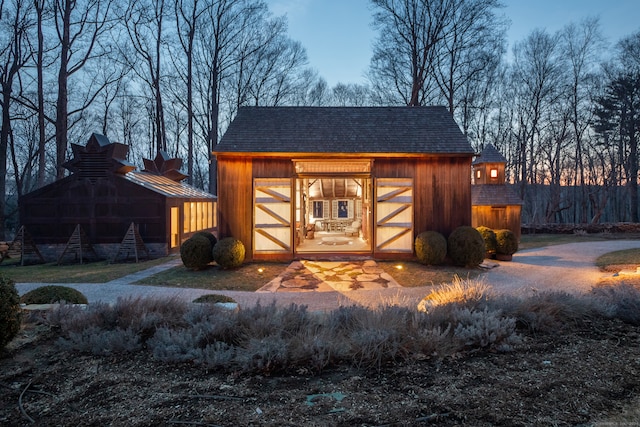 view of outdoor structure at dusk