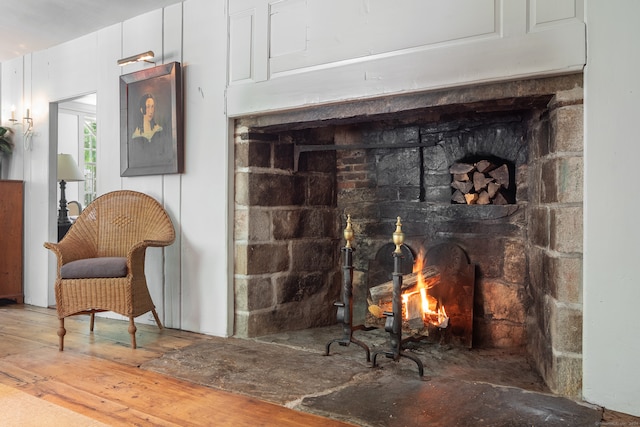 details featuring wood-type flooring and a brick fireplace