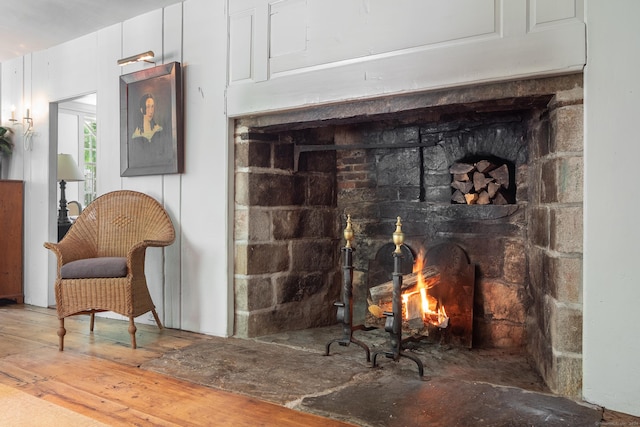 155 Joshuatown Rd, Lyme, CT 06371 - detailed view of a warm lit fireplace and wood finished floors