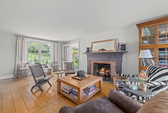 living room featuring a fireplace and light hardwood / wood-style floors