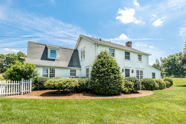 view of home's exterior featuring a lawn