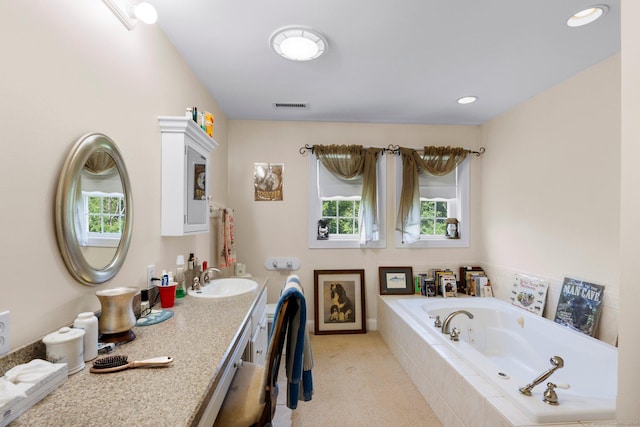 46 Nedobity Rd, Haddam, CT 06441 - bathroom with healthy amount of natural light, a jetted tub, and vanity