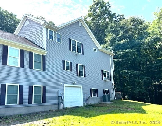 46 Nedobity Rd, Haddam, CT 06441 - view of home's exterior featuring a yard, a garage, and cooling unit