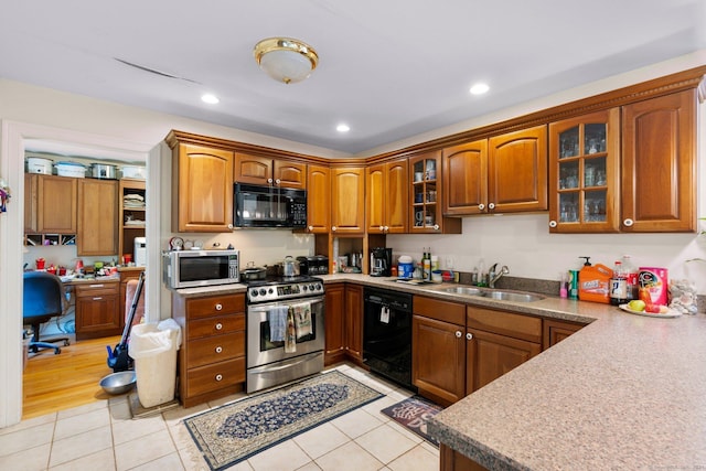 46 Nedobity Rd, Haddam, CT 06441 - kitchen with black appliances, a sink, light tile patterned floors, brown cabinetry, and recessed lighting