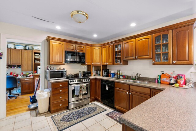 46 Nedobity Rd, Haddam, CT 06441 - kitchen with black appliances, light tile patterned flooring, brown cabinets, glass insert cabinets, and recessed lighting