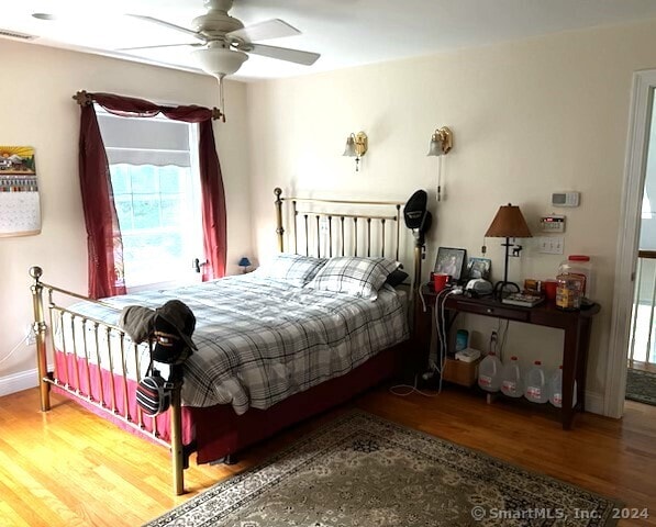 46 Nedobity Rd, Haddam, CT 06441 - bedroom with wood finished floors, multiple windows, baseboards, and ceiling fan