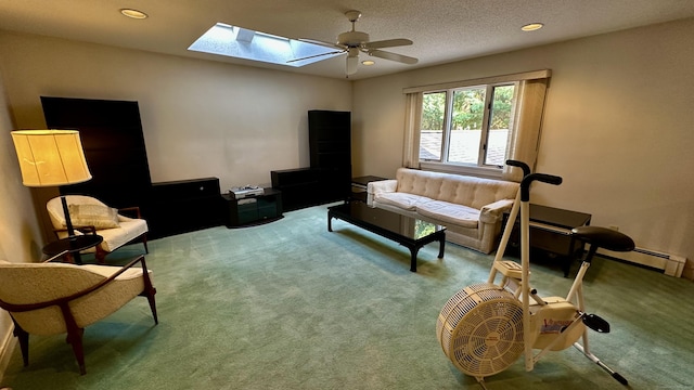 living area featuring a skylight, carpet flooring, recessed lighting, and a textured ceiling