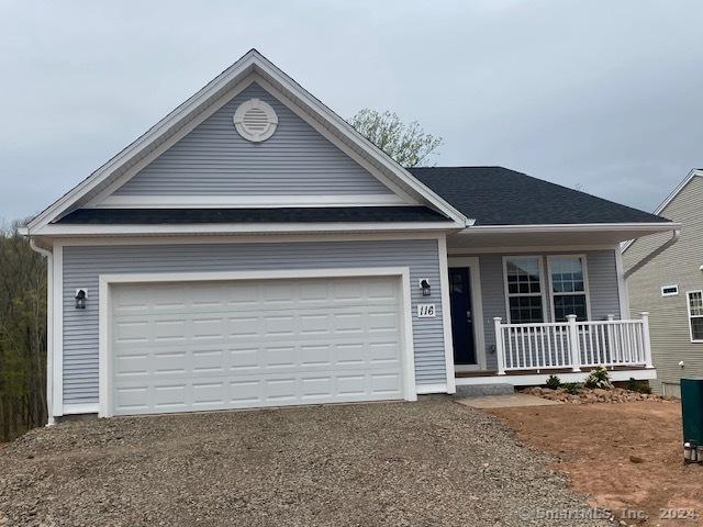 view of front of house with a garage and covered porch