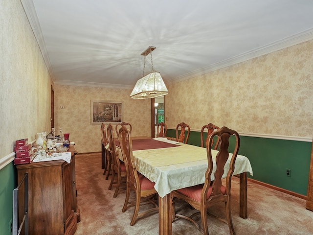 carpeted dining room with crown molding