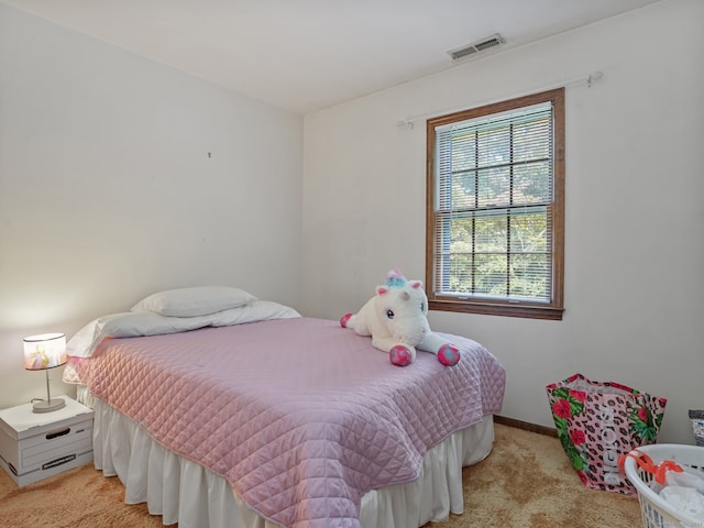 bedroom with light carpet