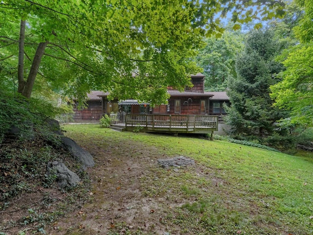 view of yard with a wooden deck