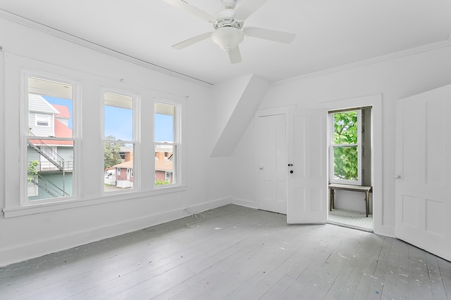 bonus room with ceiling fan, wood-type flooring, and a wealth of natural light