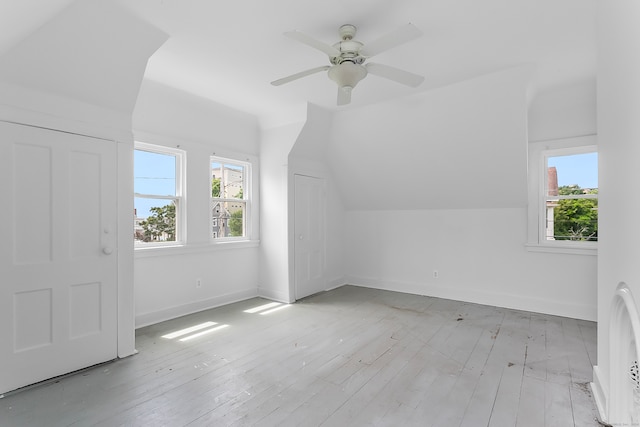 additional living space featuring light hardwood / wood-style flooring, ceiling fan, and vaulted ceiling