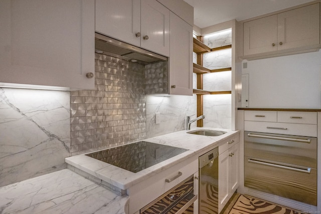 kitchen featuring sink, white cabinets, dishwasher, and tasteful backsplash