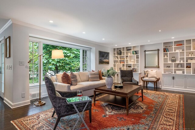 living room with ornamental molding and wood-type flooring