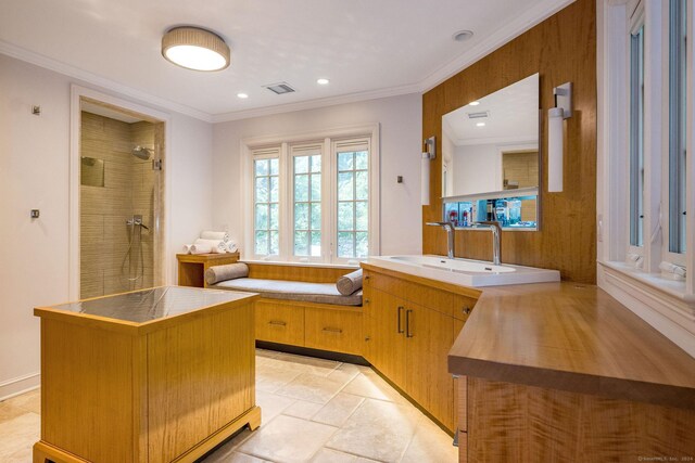 bathroom featuring vanity, ornamental molding, tile patterned floors, and separate shower and tub