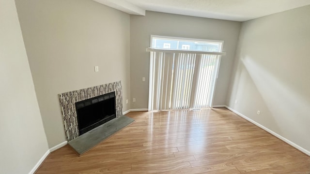 unfurnished living room featuring light hardwood / wood-style flooring