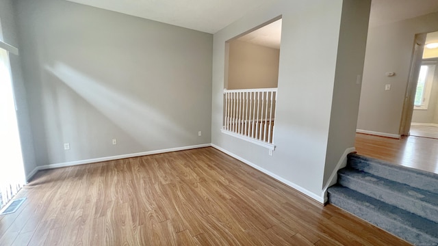 spare room featuring light hardwood / wood-style floors