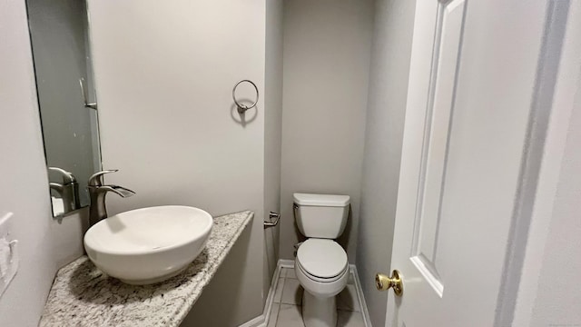 bathroom featuring tile patterned floors and toilet