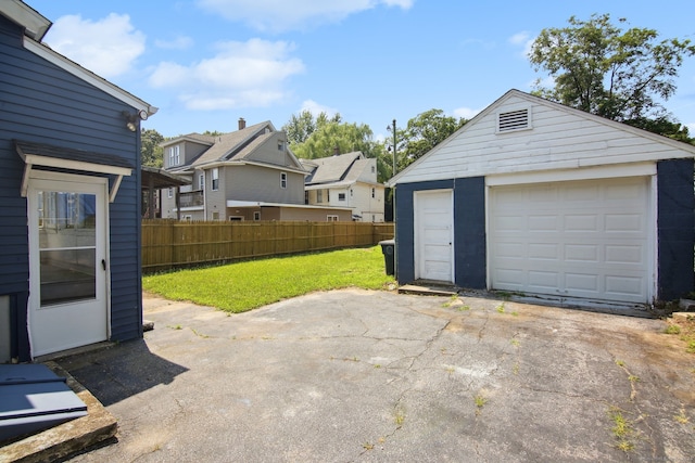 garage featuring a yard