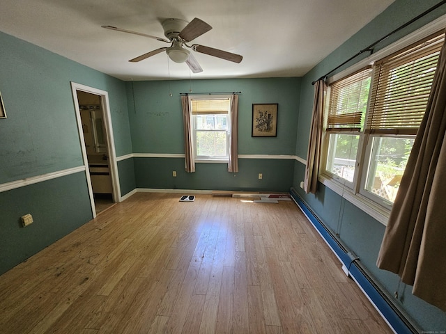 unfurnished room with ceiling fan and light hardwood / wood-style flooring