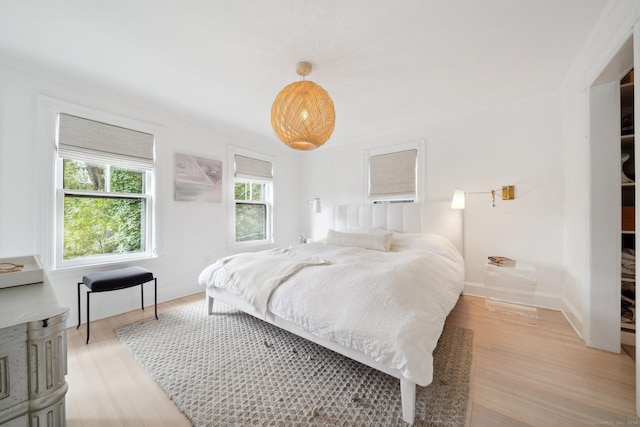 bedroom with light wood-style floors