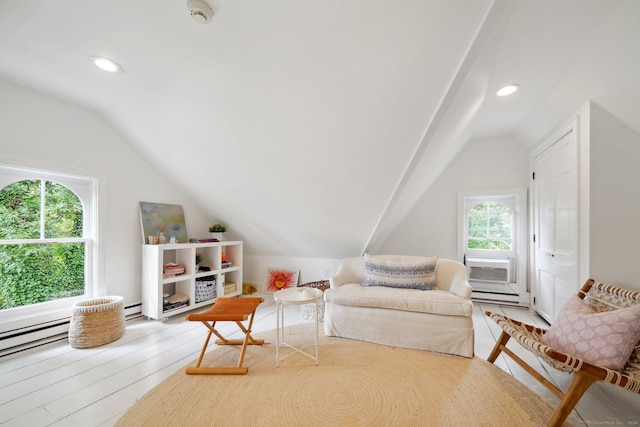 living area featuring vaulted ceiling, a baseboard radiator, recessed lighting, and wood finished floors