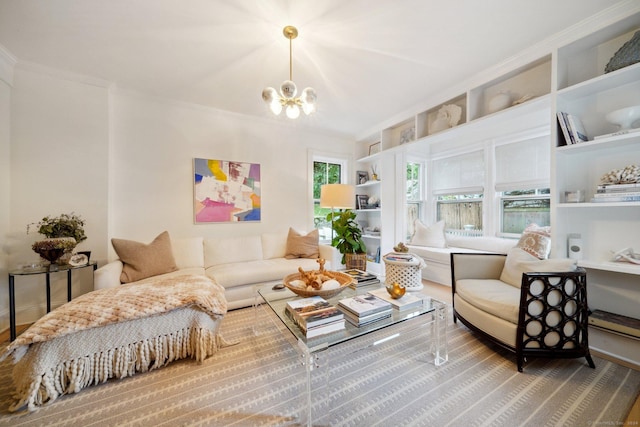living area with a chandelier, crown molding, built in shelves, and wood finished floors