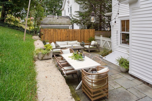 view of patio with outdoor lounge area, fence, and outdoor dining area
