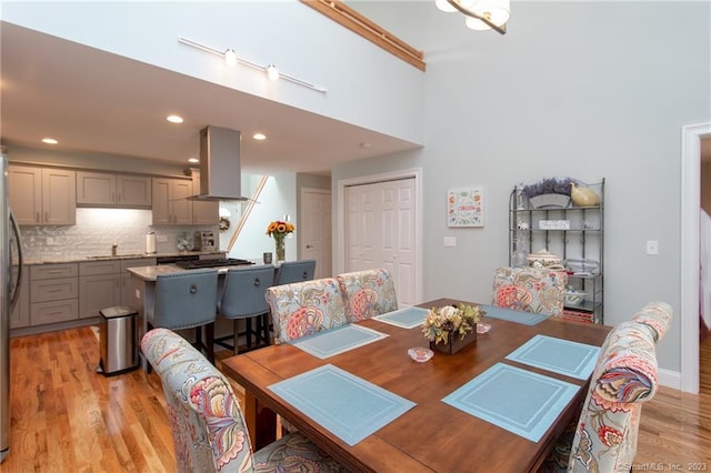 dining space with light wood-type flooring