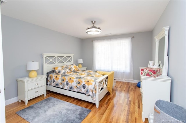 bedroom with light hardwood / wood-style flooring